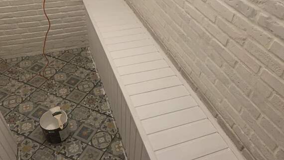 Отделка камнем с утеплением балкона Сапожок